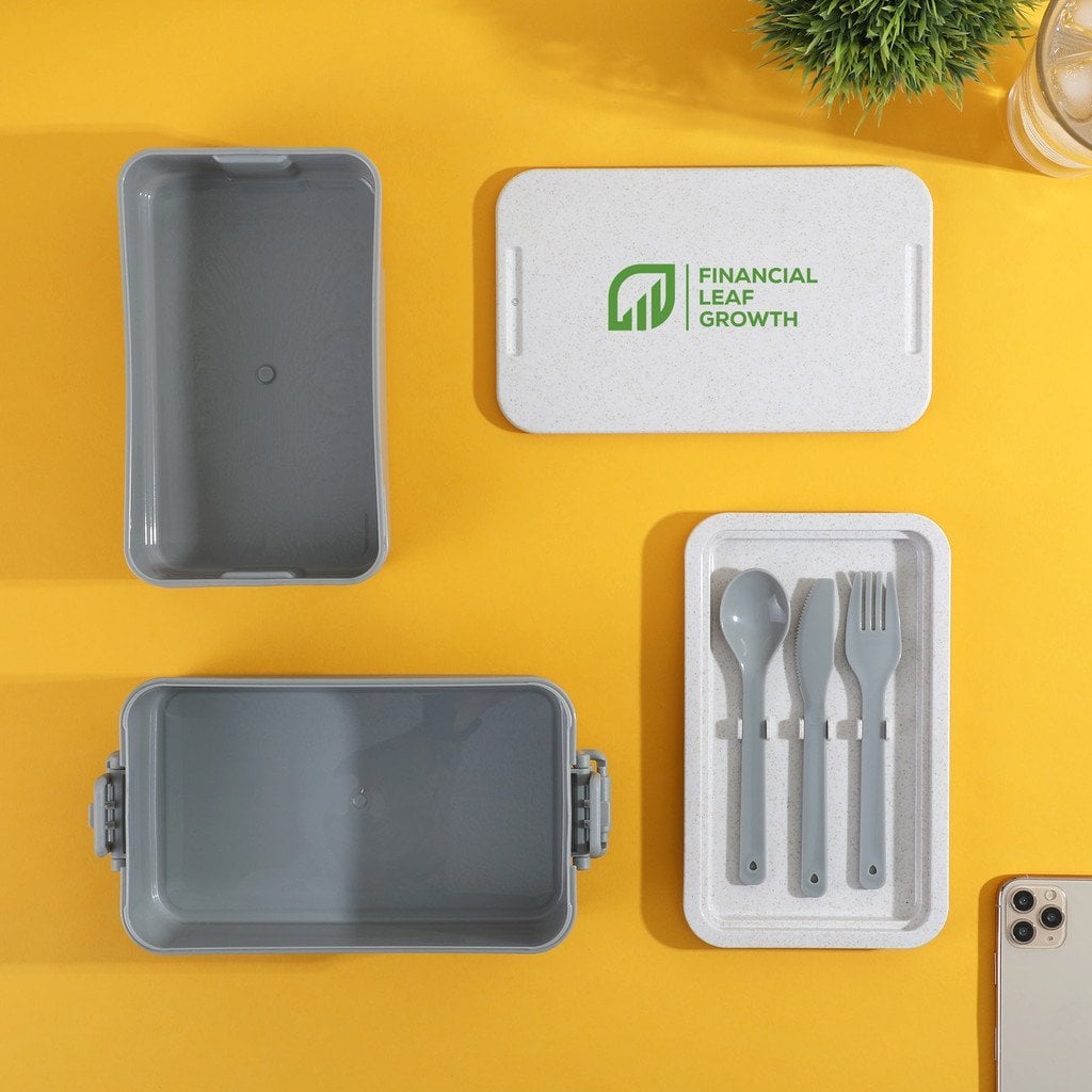 Custom branded eco-friendly lunch box with utensils and logo on yellow background.